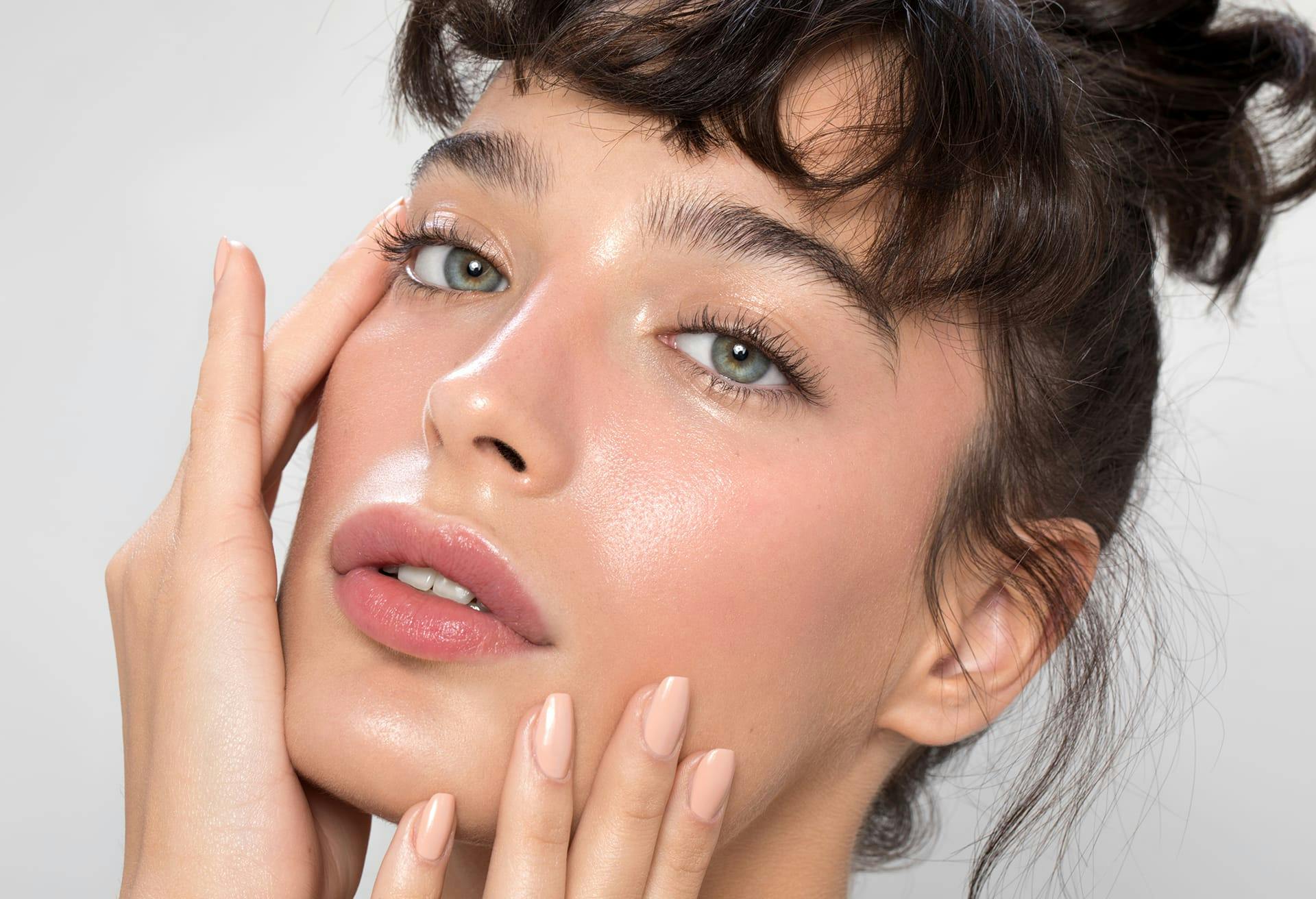 there is a woman with hands on her face