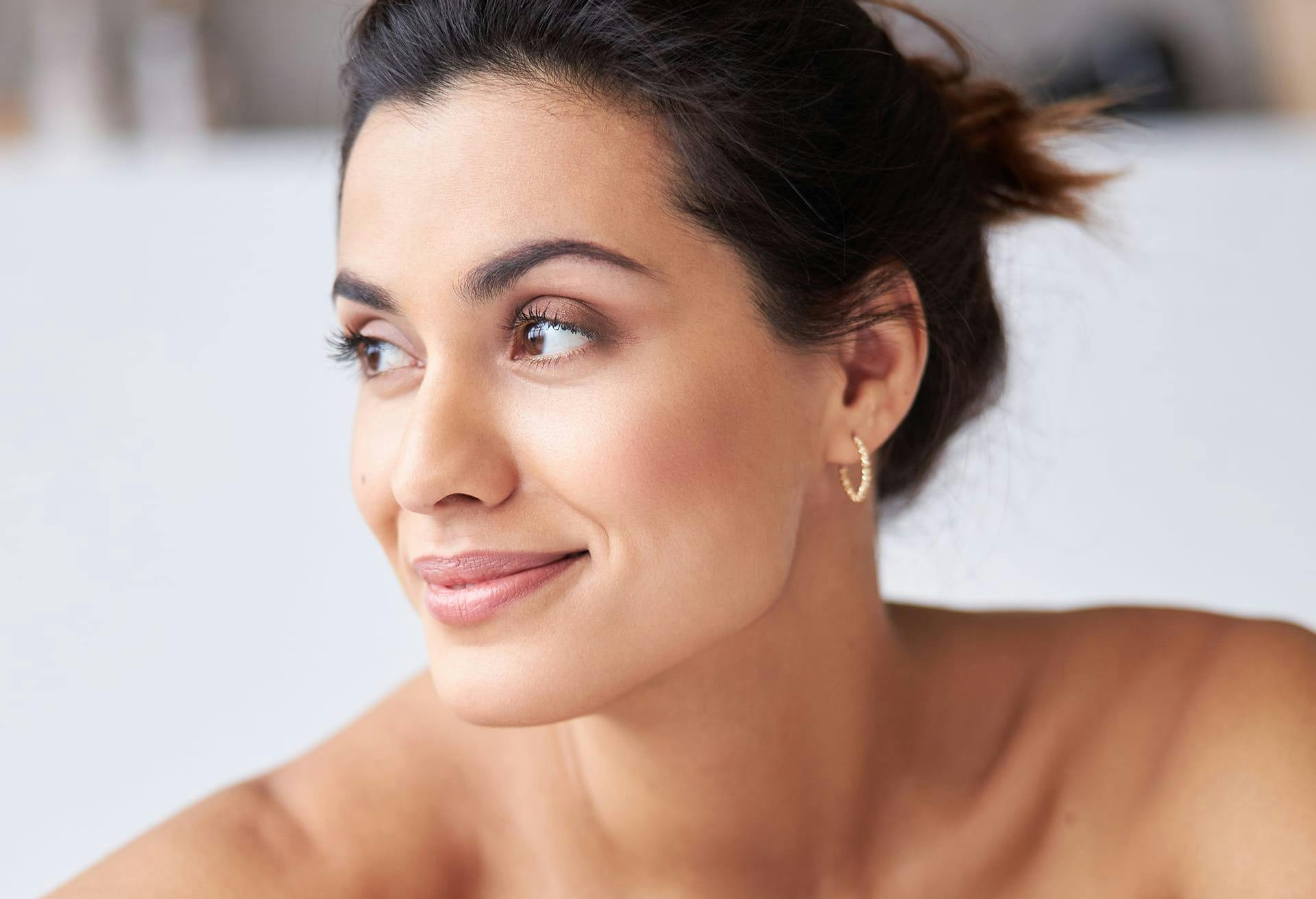 woman posing for picture looking to the side