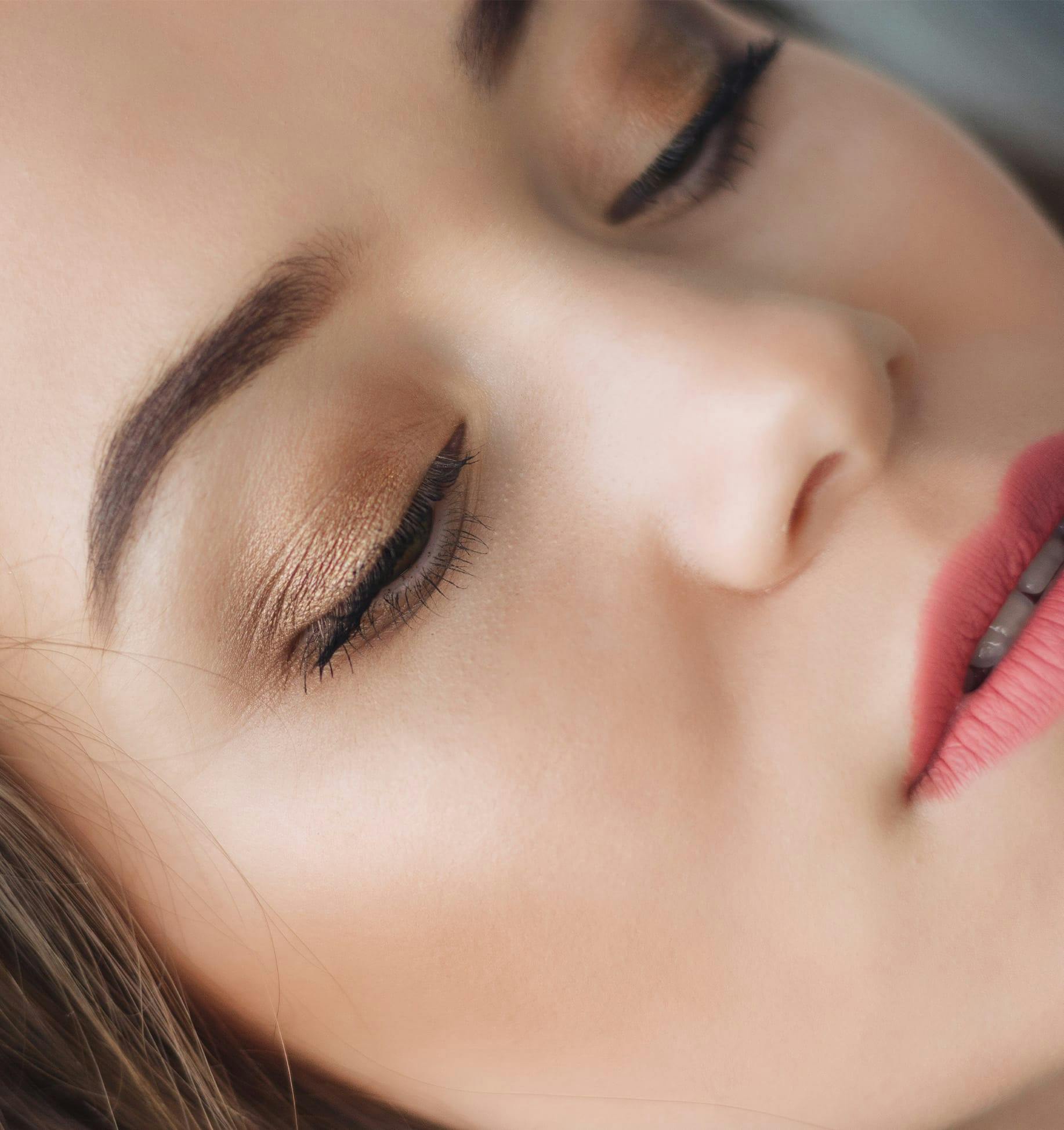 close up of woman face with pink lipstick