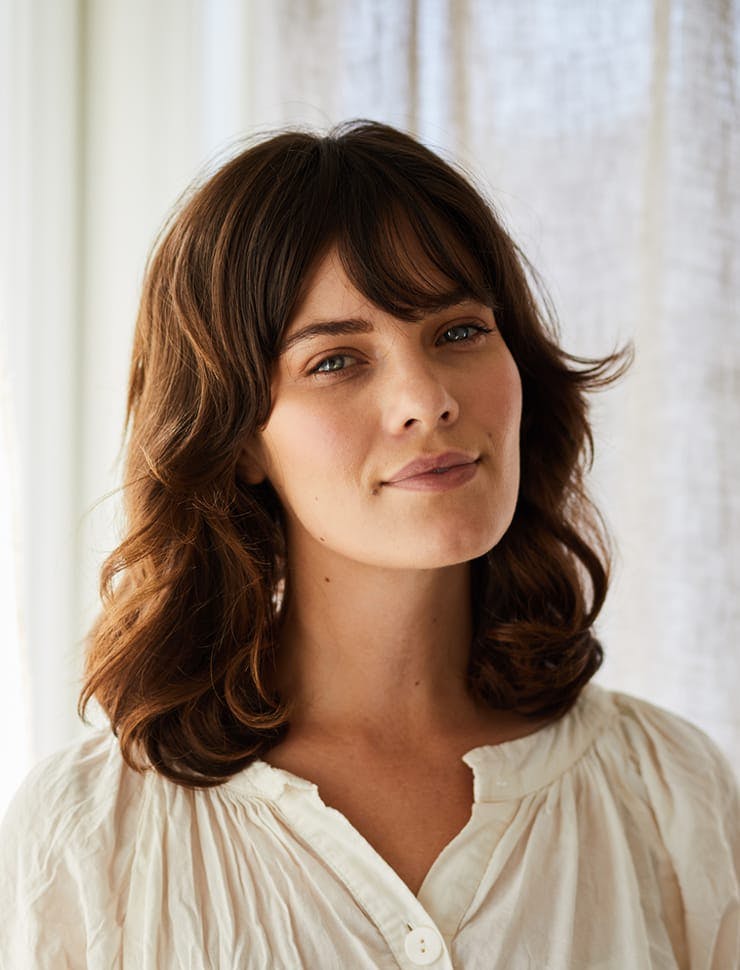 woman with a white shirt and blue eyes