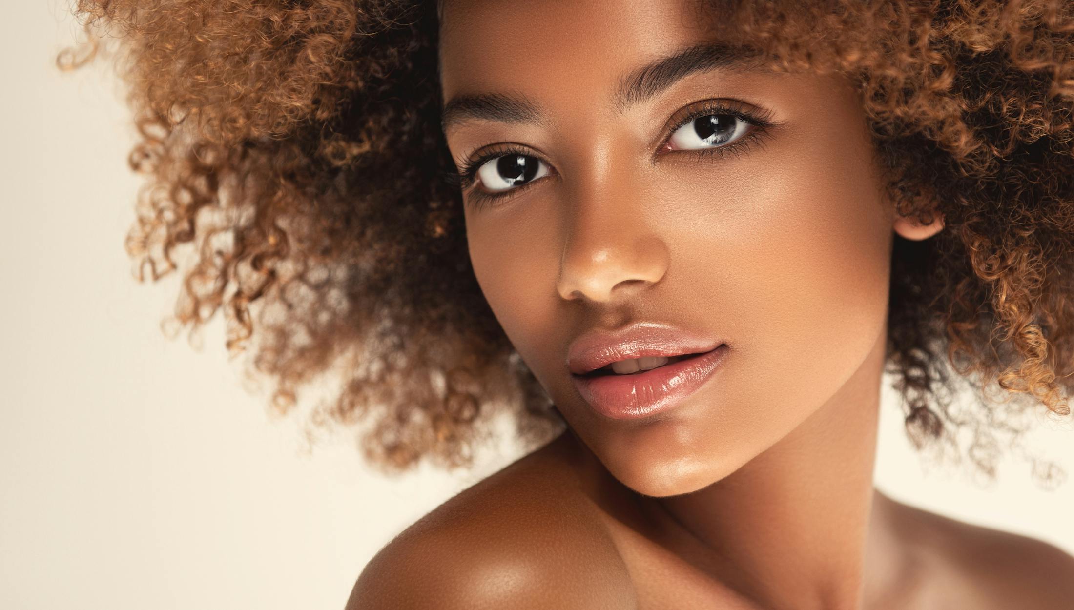woman with a very large afro hair posing for a picture