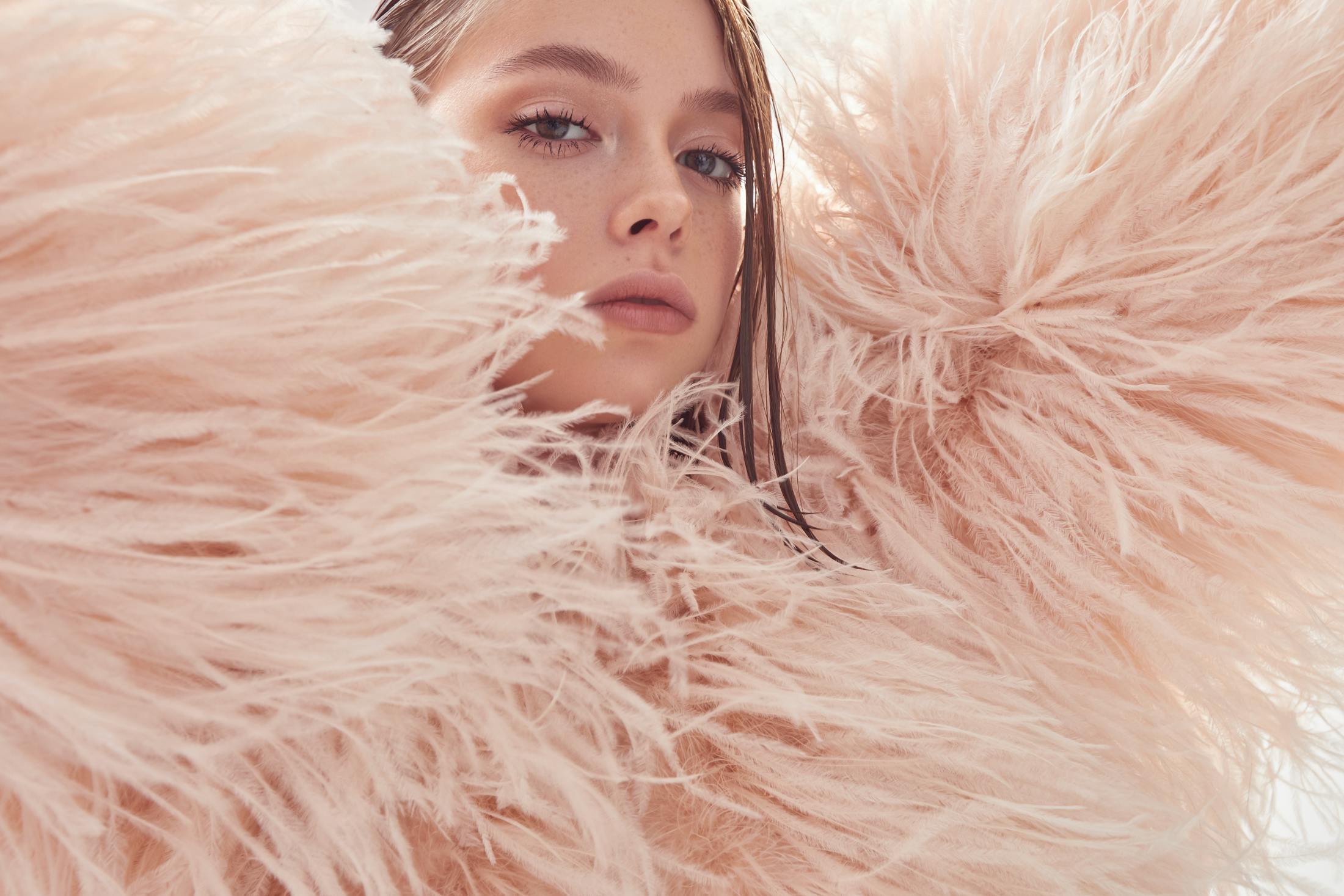 Woman in feather coat