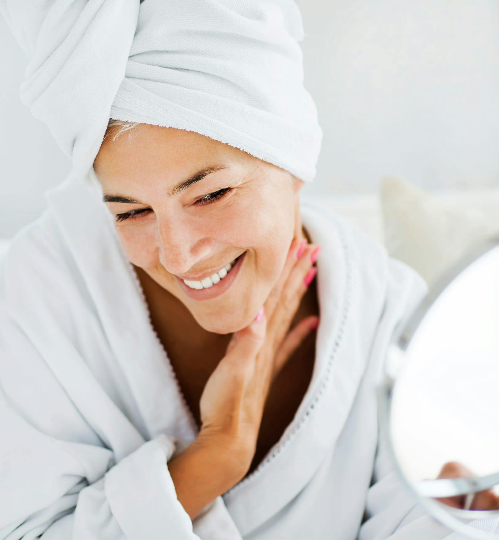 woman in a robe with her hair wrapped in a towel