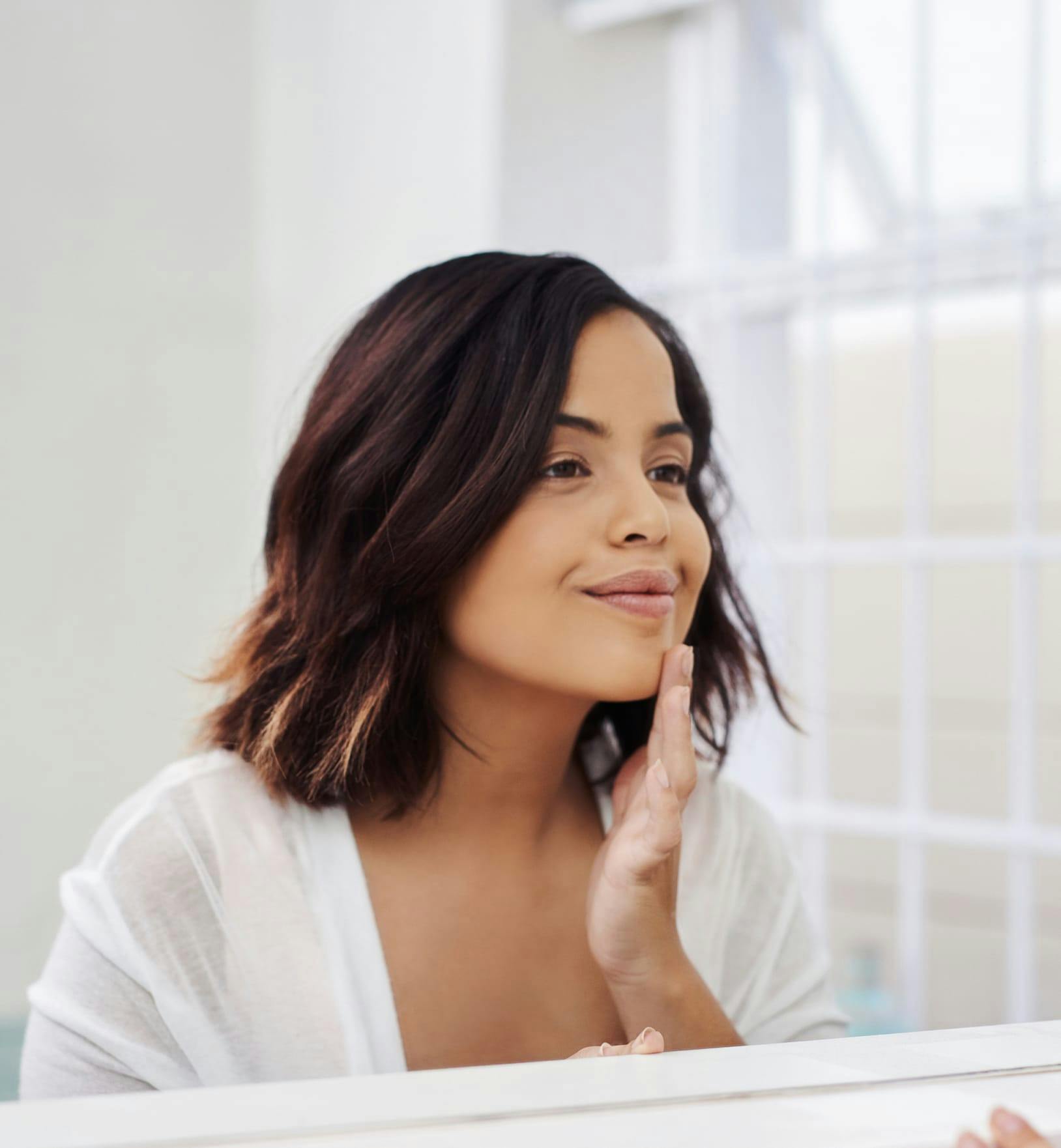 person touching their face