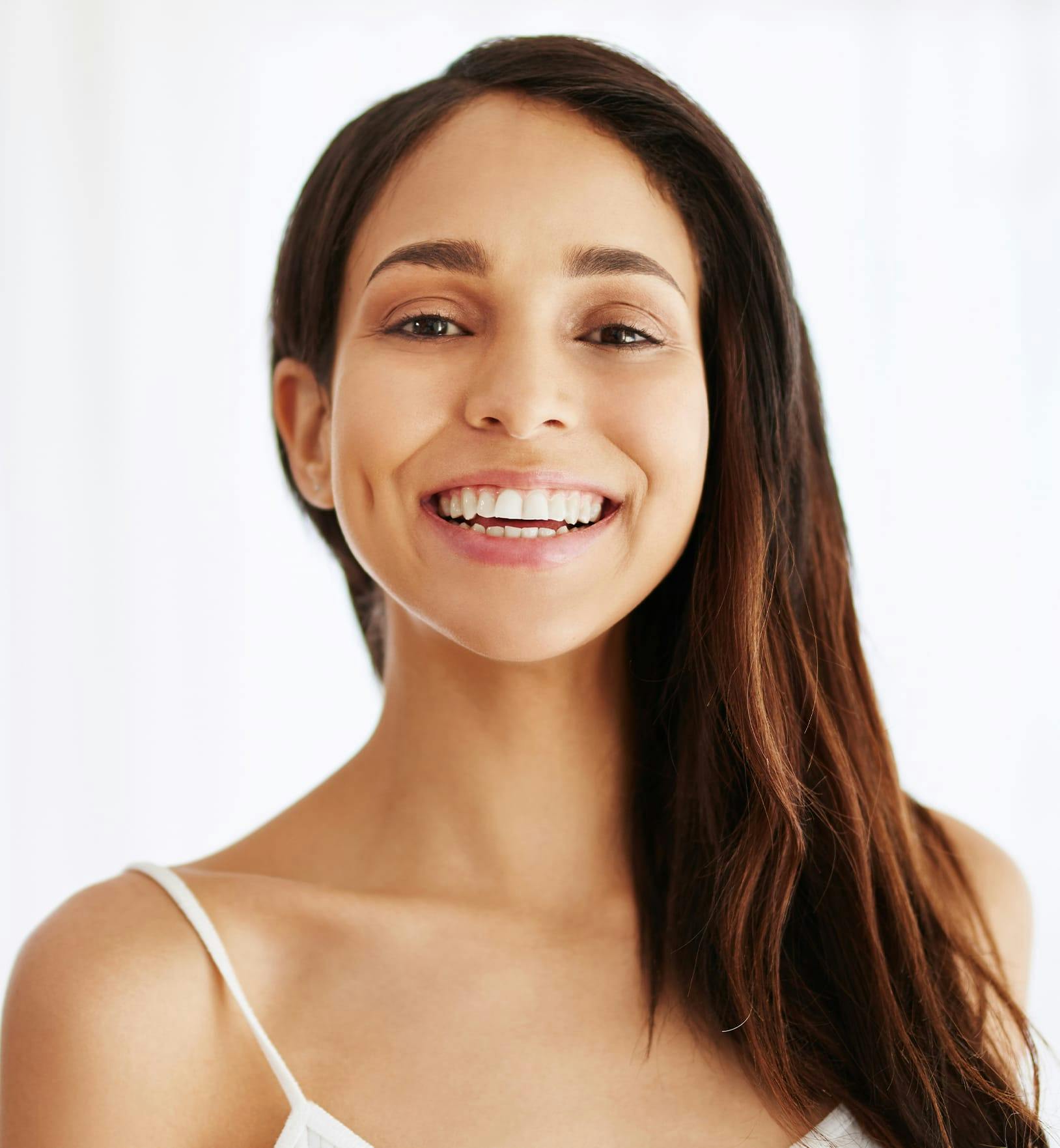 Woman with long auburn hair smiling