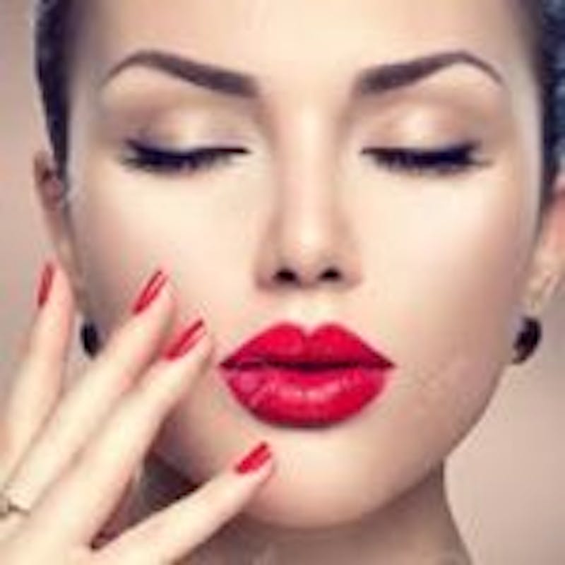 woman with red lips and nails