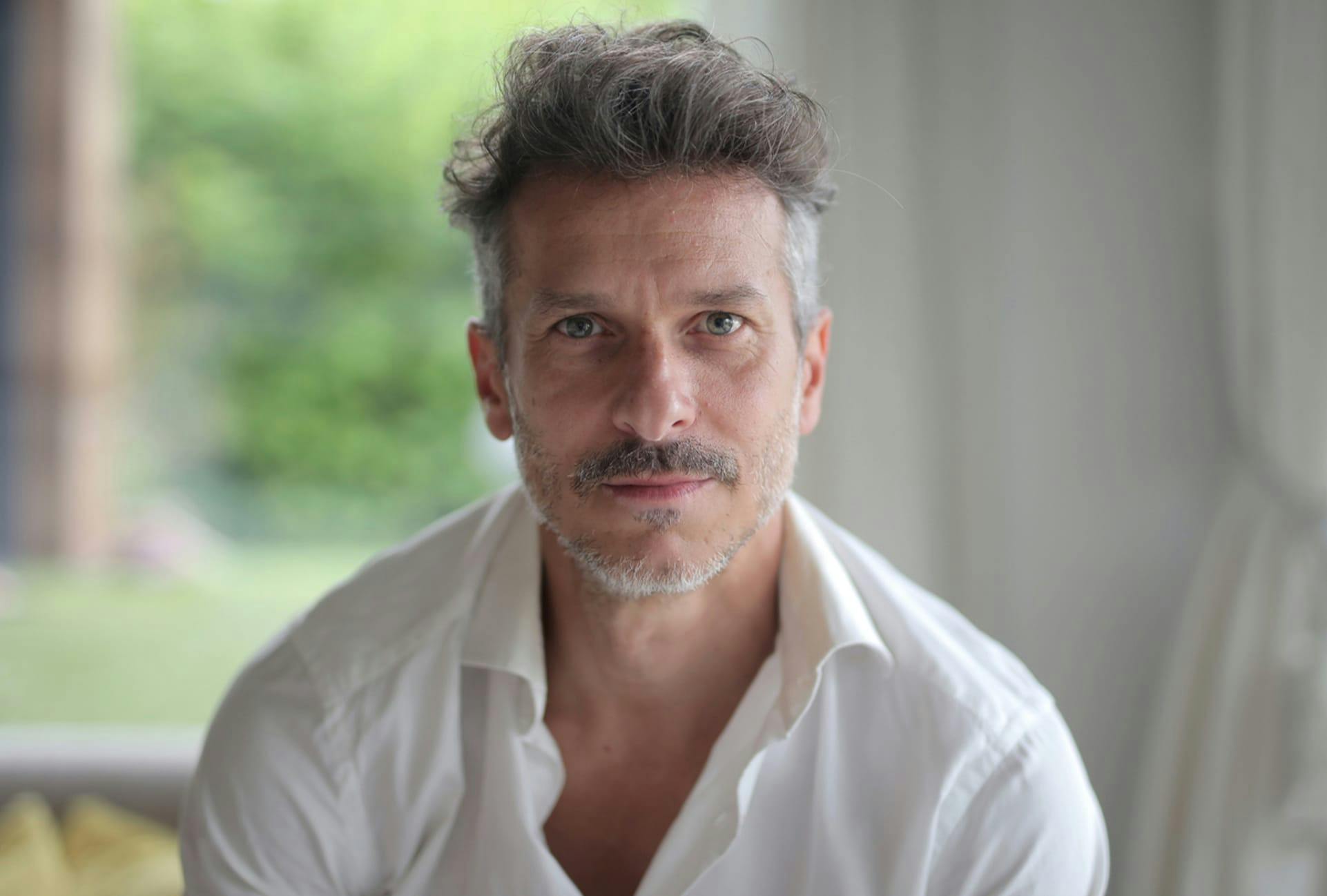 man in a white button up top