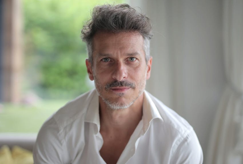 man in a white button up top