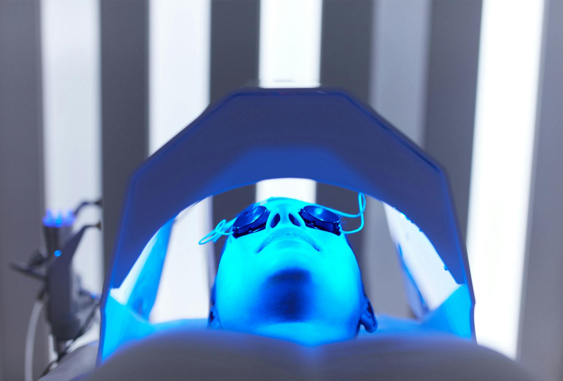 person getting blu u light therapy