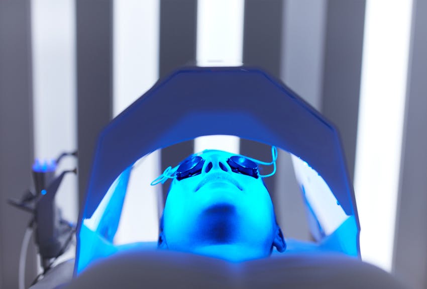 person getting blu u light therapy