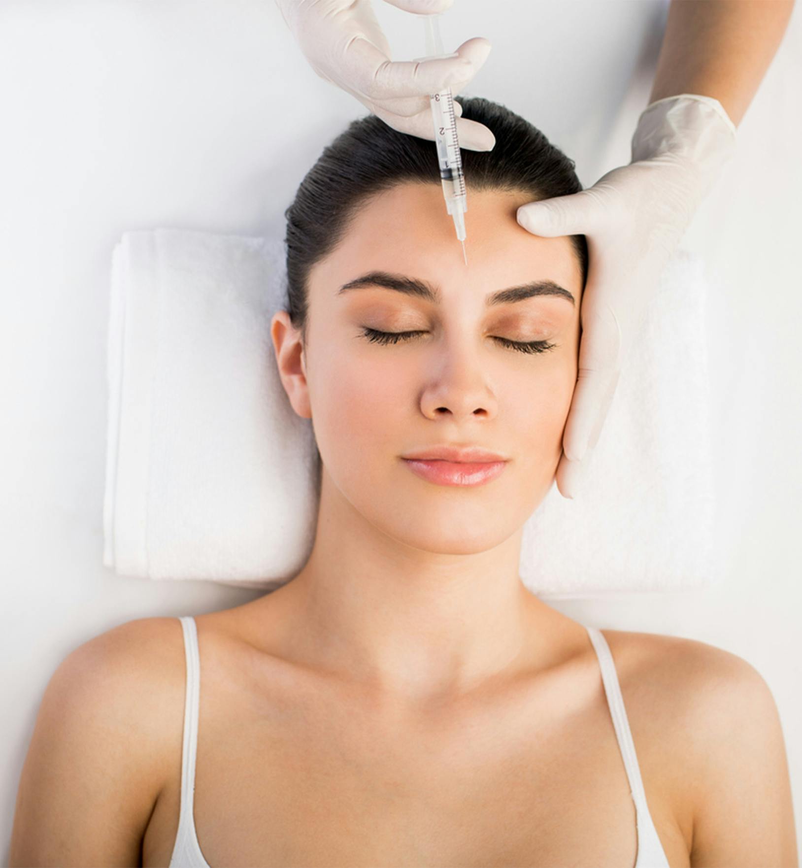 Female patient receiving BOTOX treatment in the forhead area
