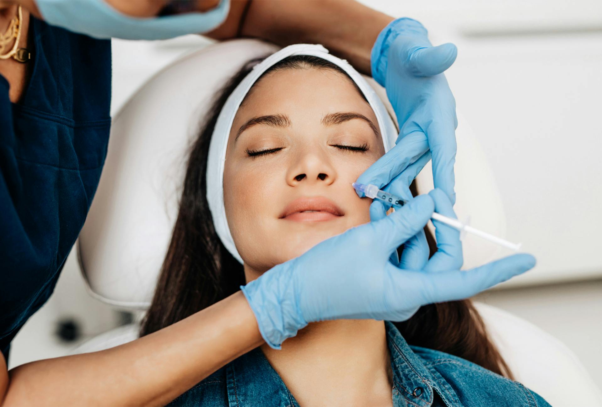 Woman receiving injectable treatment at The Dermatology Center