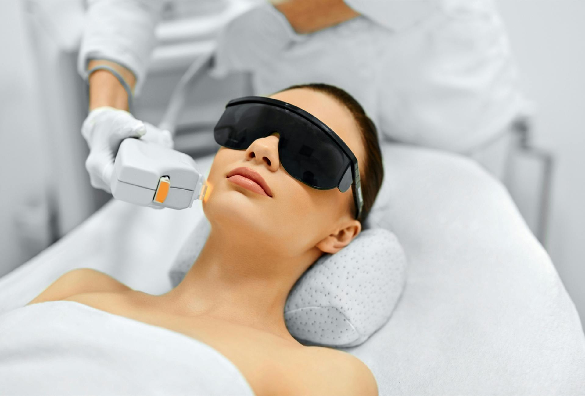 Woman receiving a laser treatment at The Dermatology Center