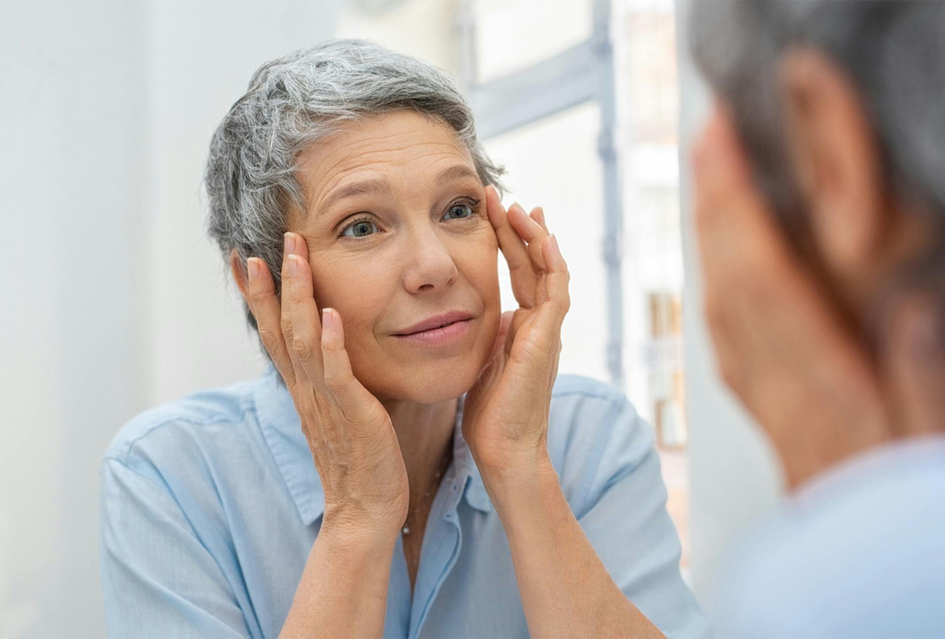 woman looking in a mirror