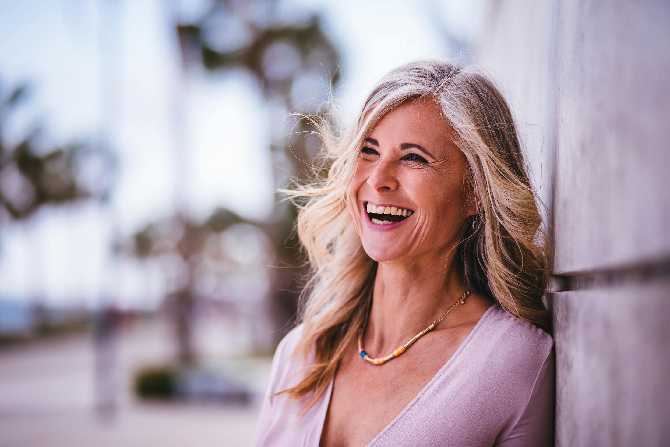Beautiful middle aged woman smiling outside
