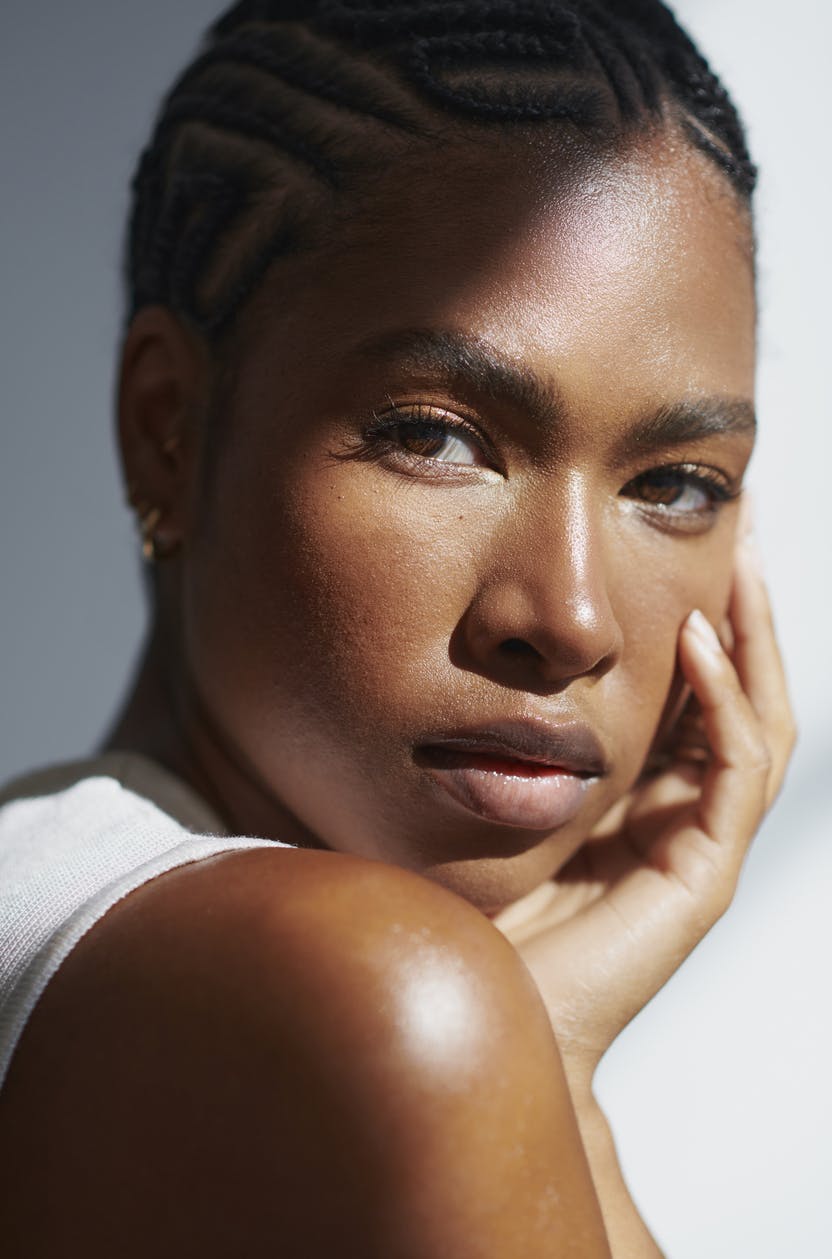 Black woman in portrait shoot with acne free skin shows of possible results with AVAVA Treatments in Fredericksburg