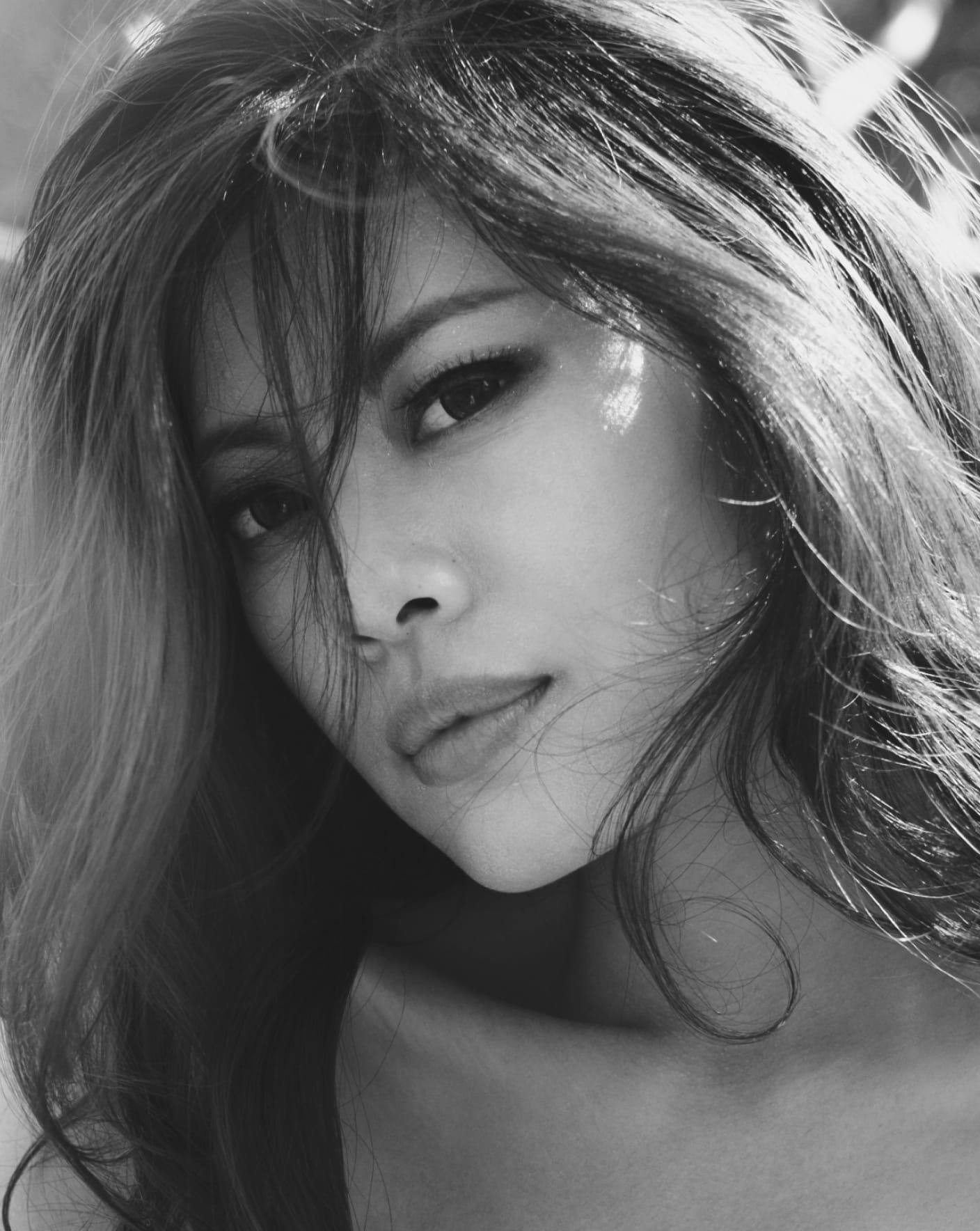 Close up black and white photo of pretty woman.