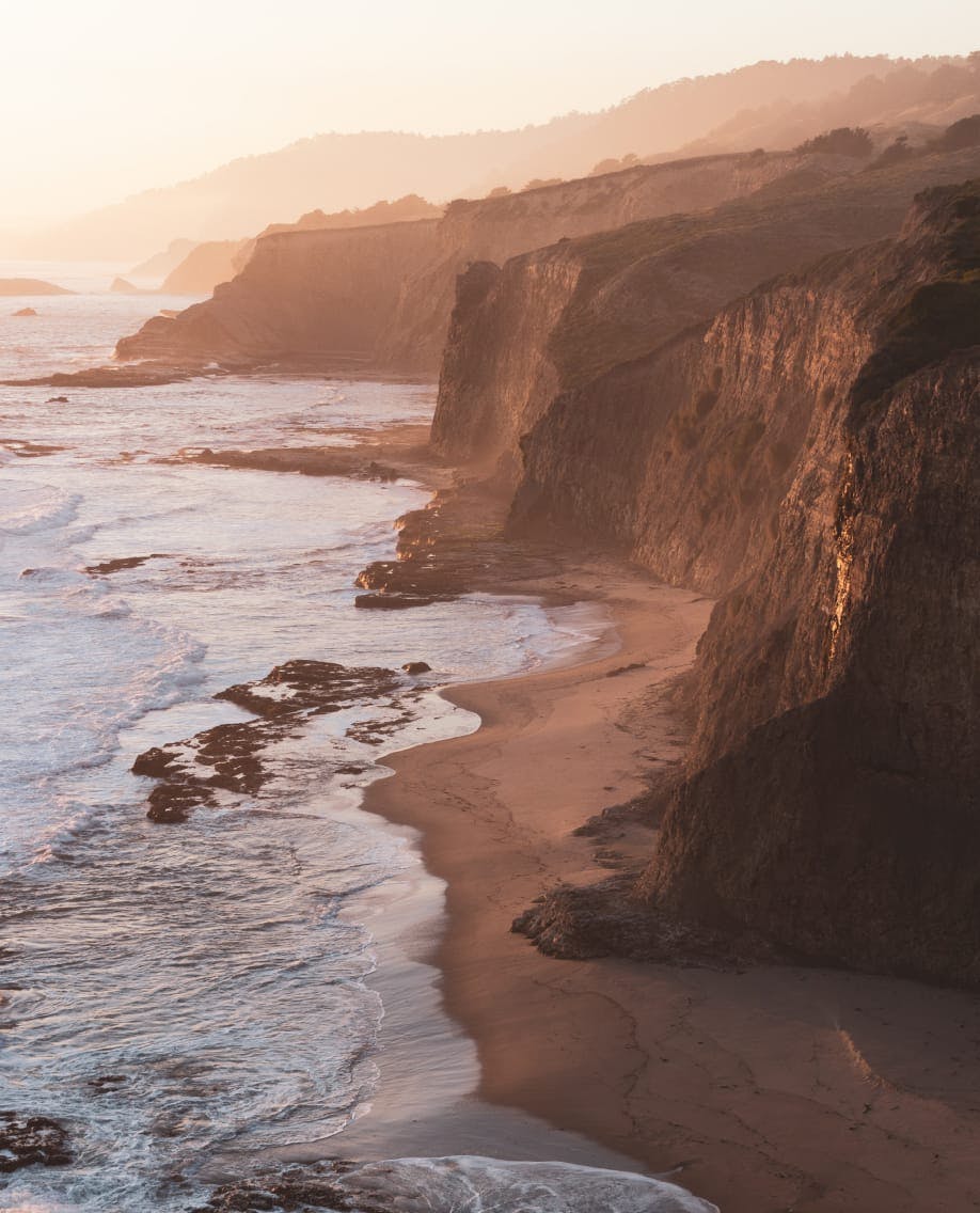 wide image of a cliff side at the beach