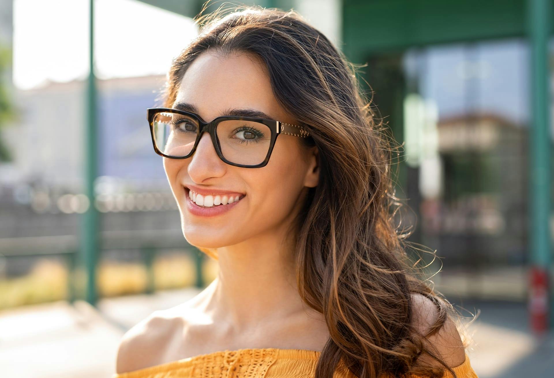 Woman with Glasses Smiling