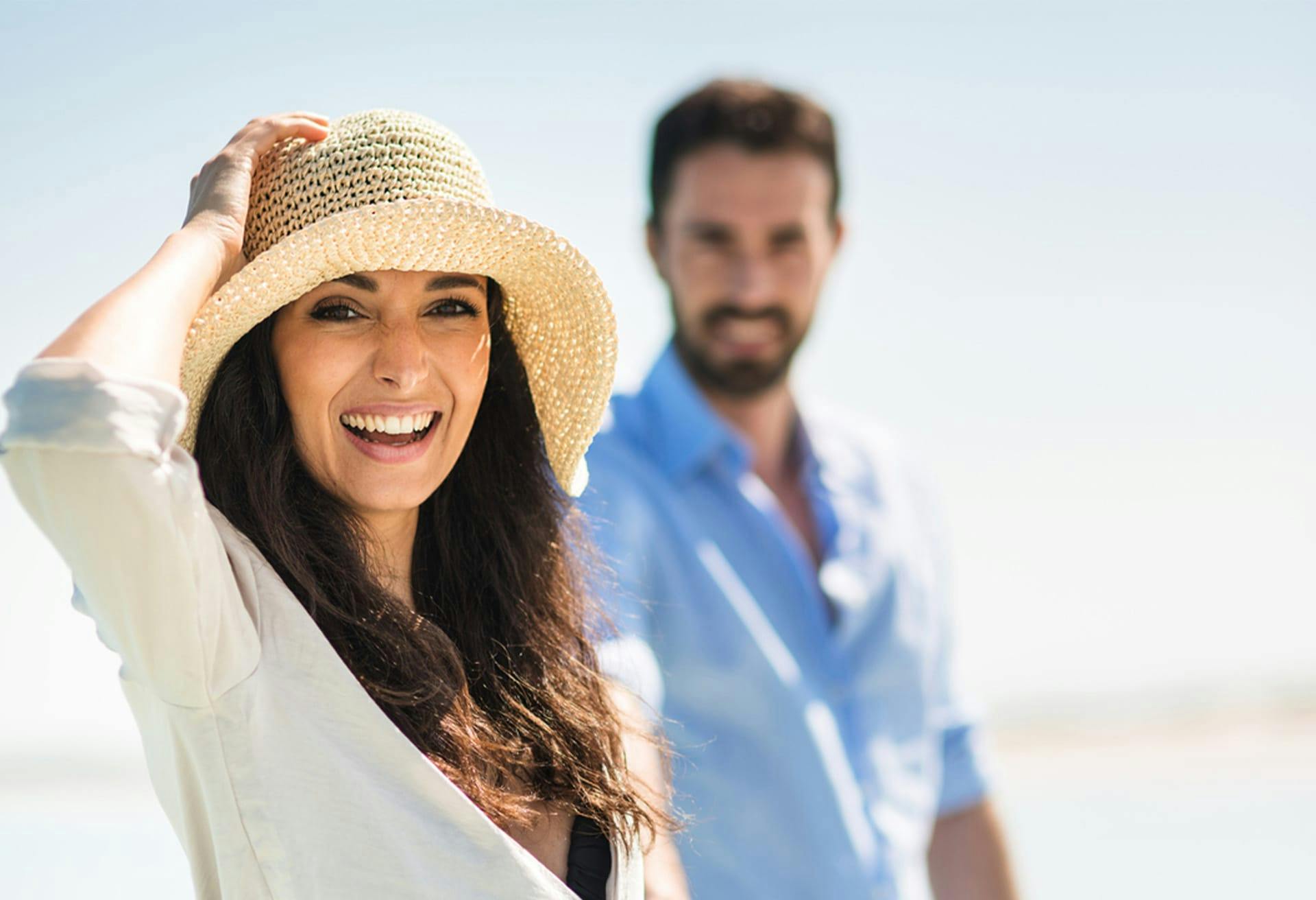 Woman on the Beach in a Sun Hat