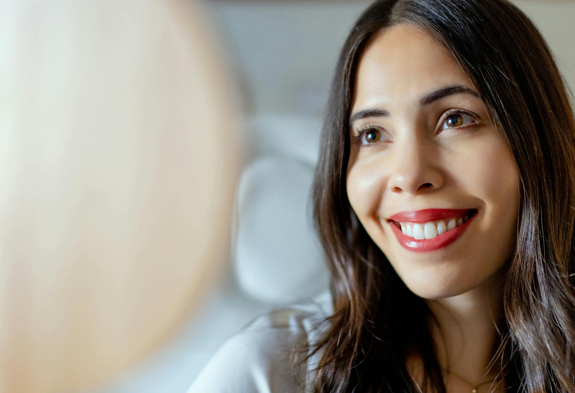 Closeup of Woman with Dark Hair and Red Lipstick