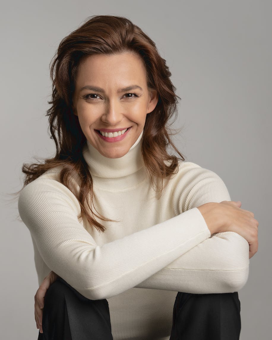 beautiful older woman smiling to camera in a studio shoot