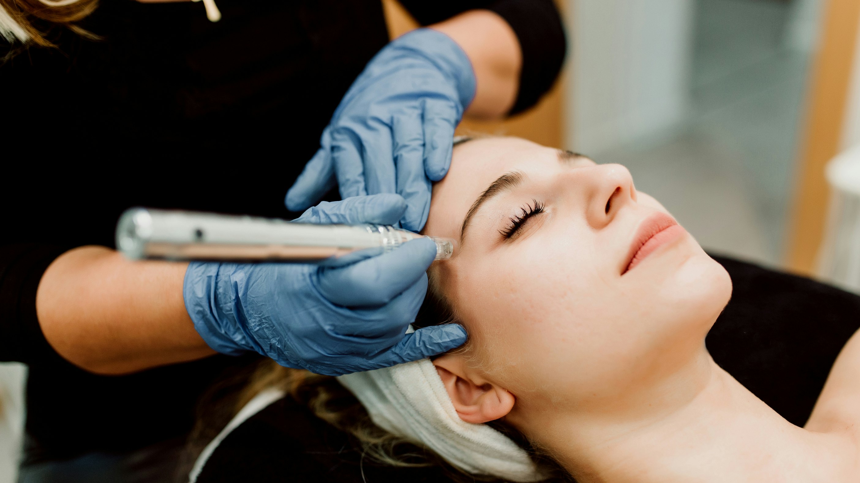 woman during facial and skin care treatment