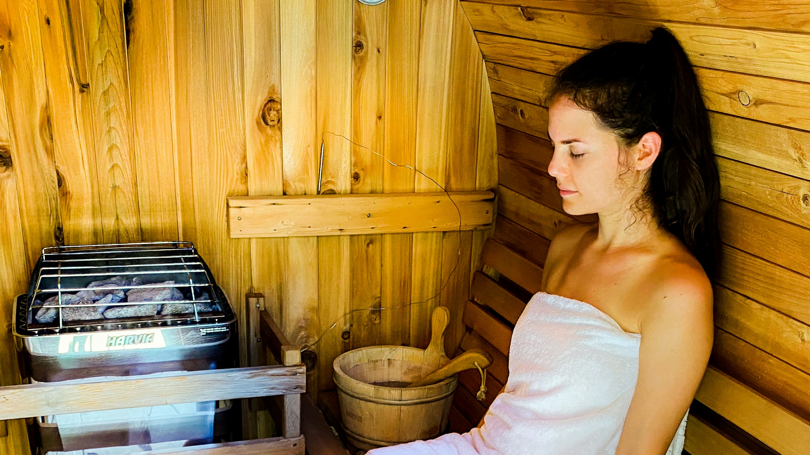 Sitting inside the barrel sauna