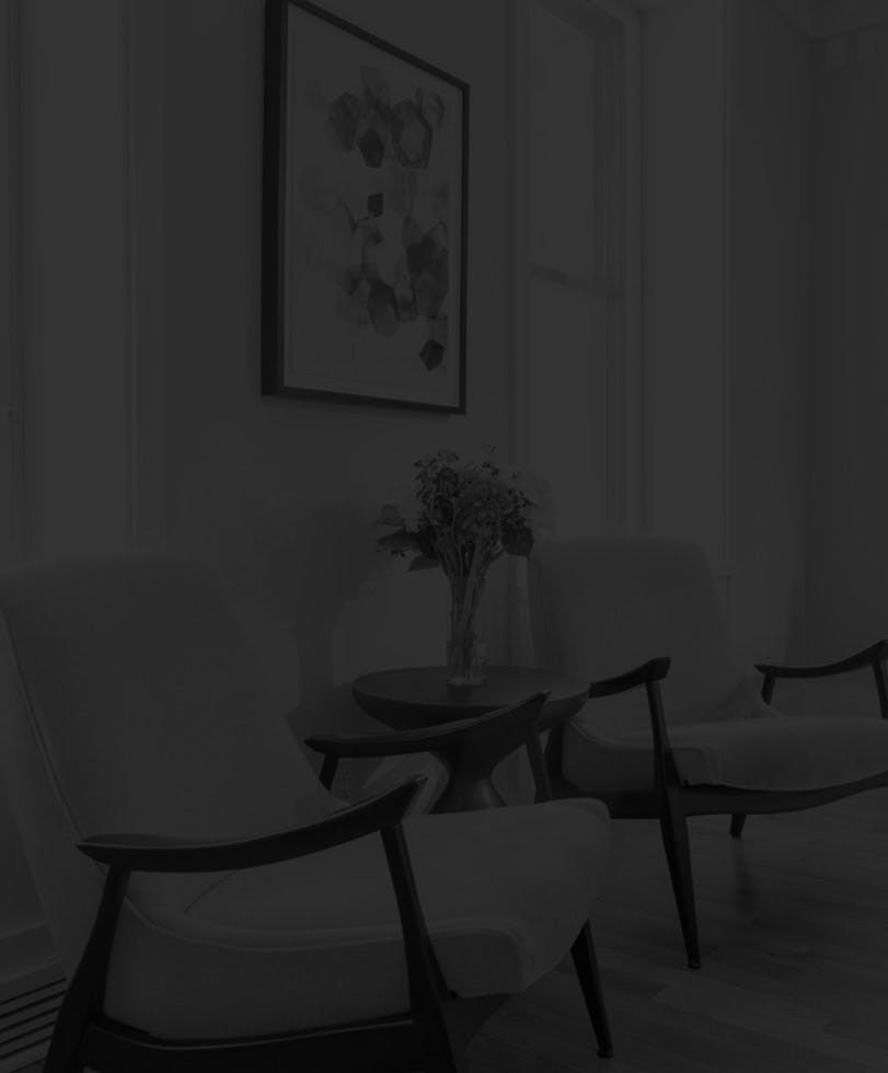 Waiting Area with Two White Chairs