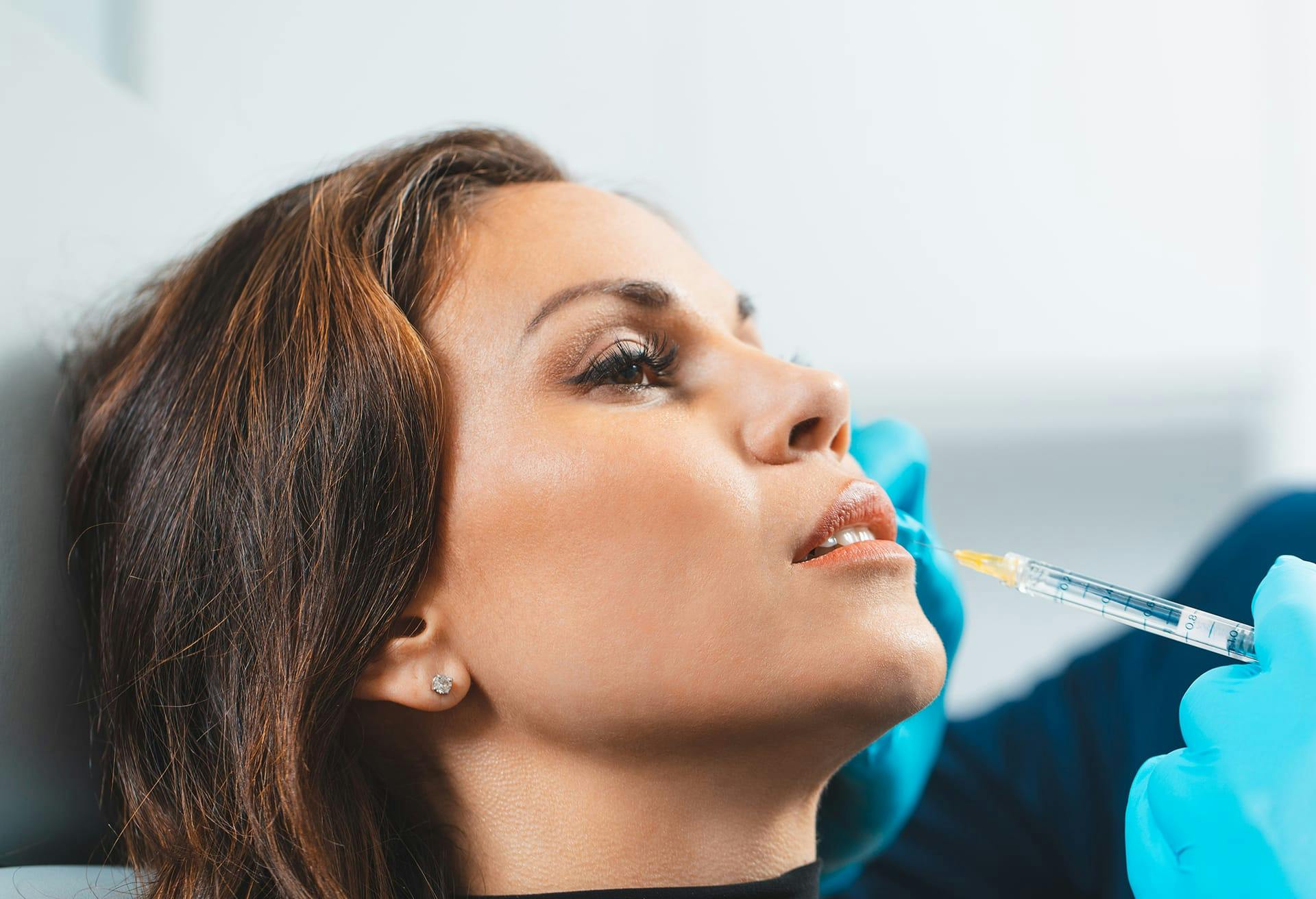 Woman Receiving Lip Injections