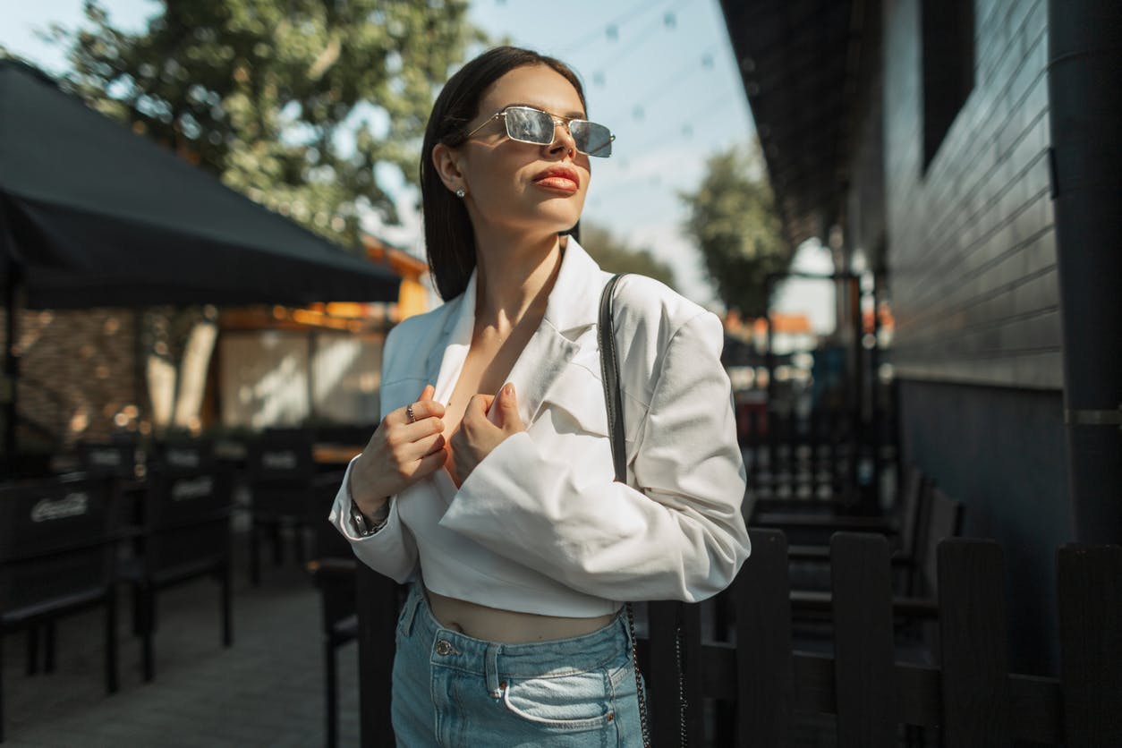 Model wearing sunglasses looking to the side