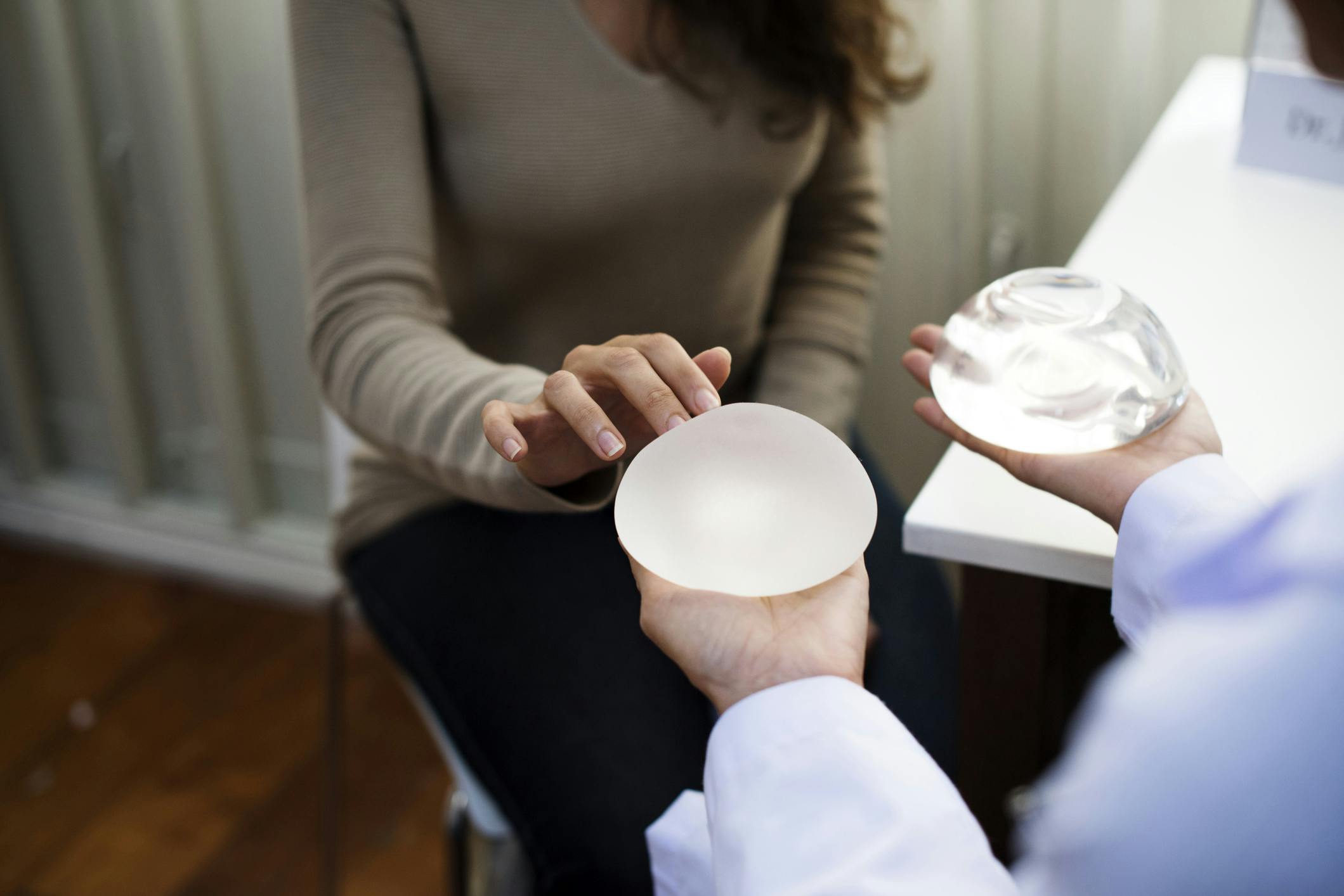 Patient looking at silicone implants