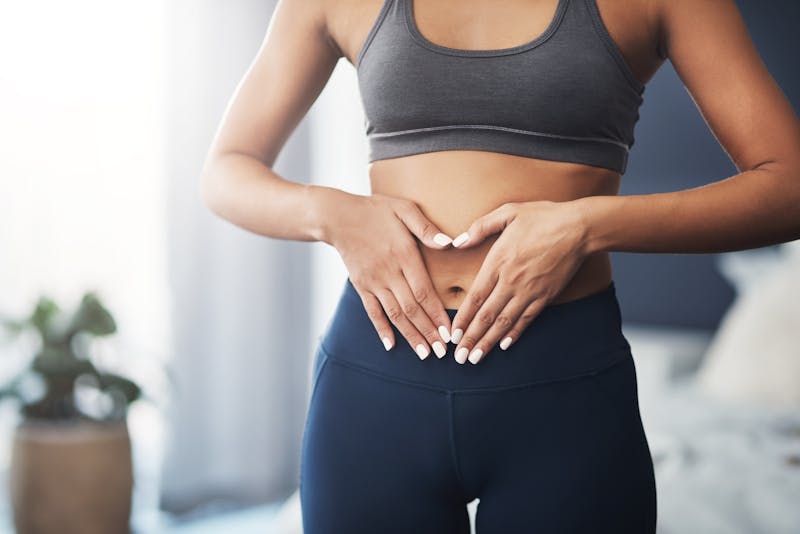 woman touching her stomach