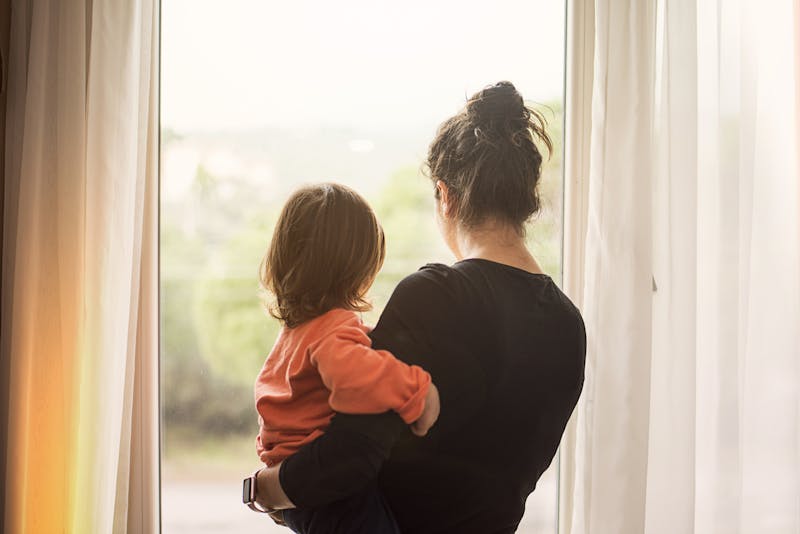 woman holding her child on her hip