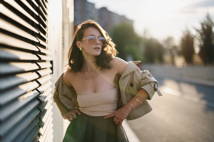 woman in stylish sunglasses and jacket