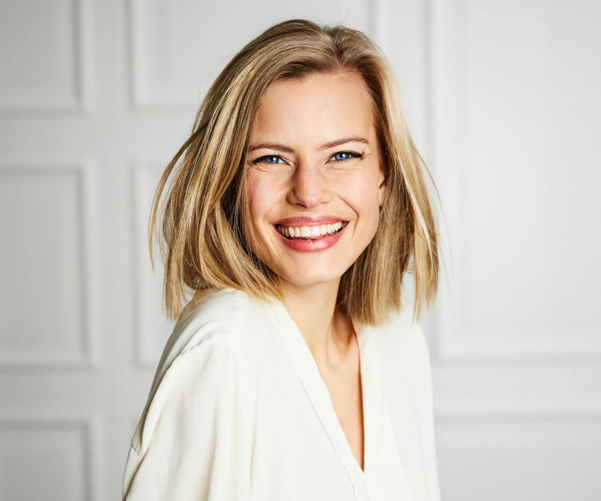 a woman smiling after getting Invisalign in Bluffton and Hilton Head