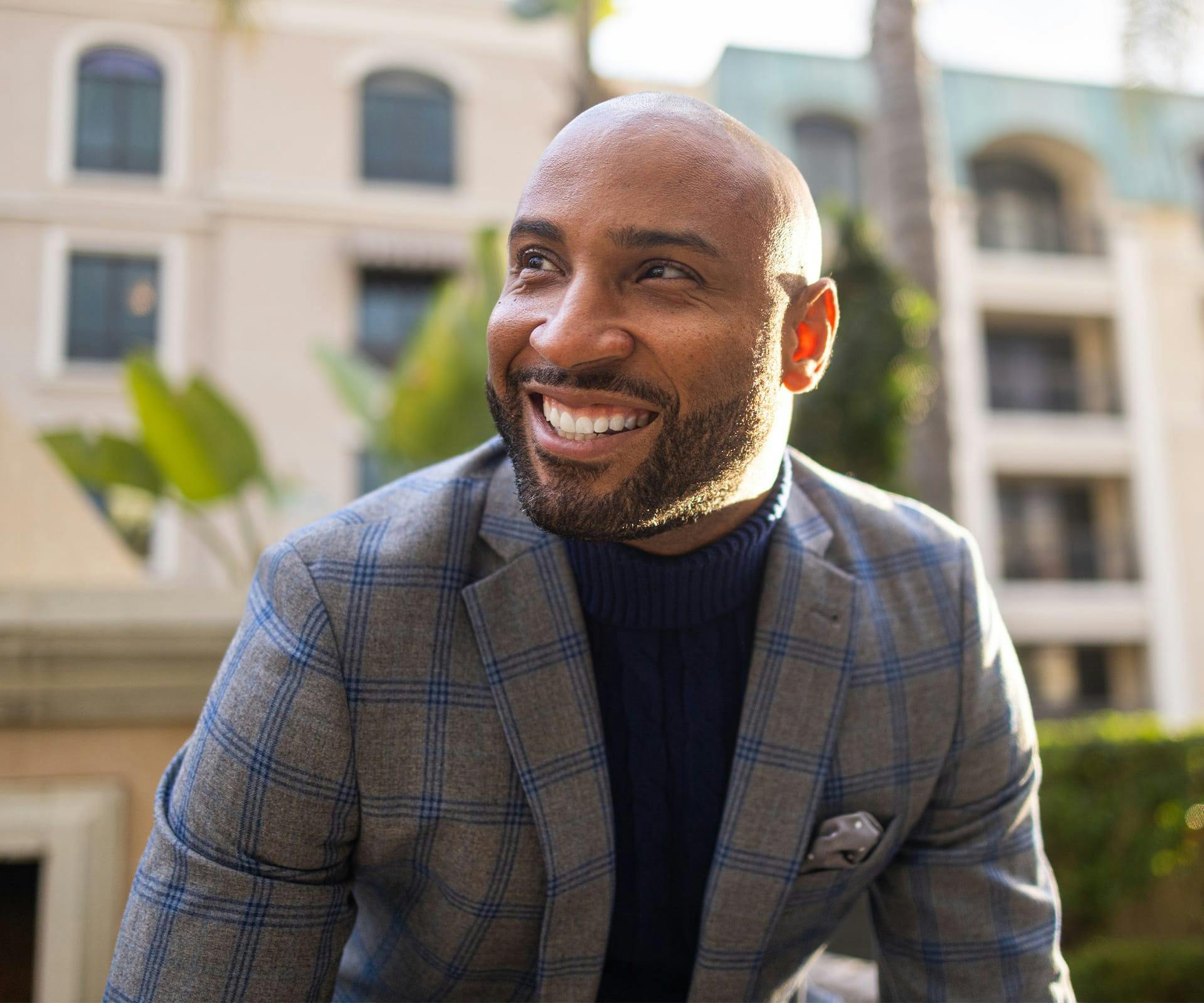 a man sitting outside and smiling after getting a dental crown in Bluffton and Hilton Head