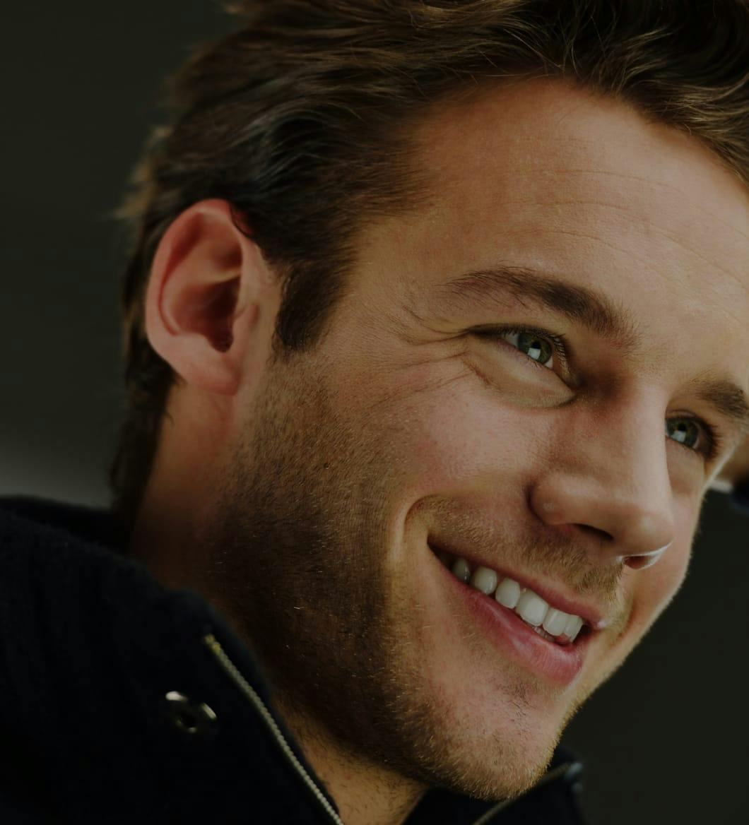 a smiling man showing off perfect teeth after getting cosmetic dentistry in Bluffton and Hilton Head