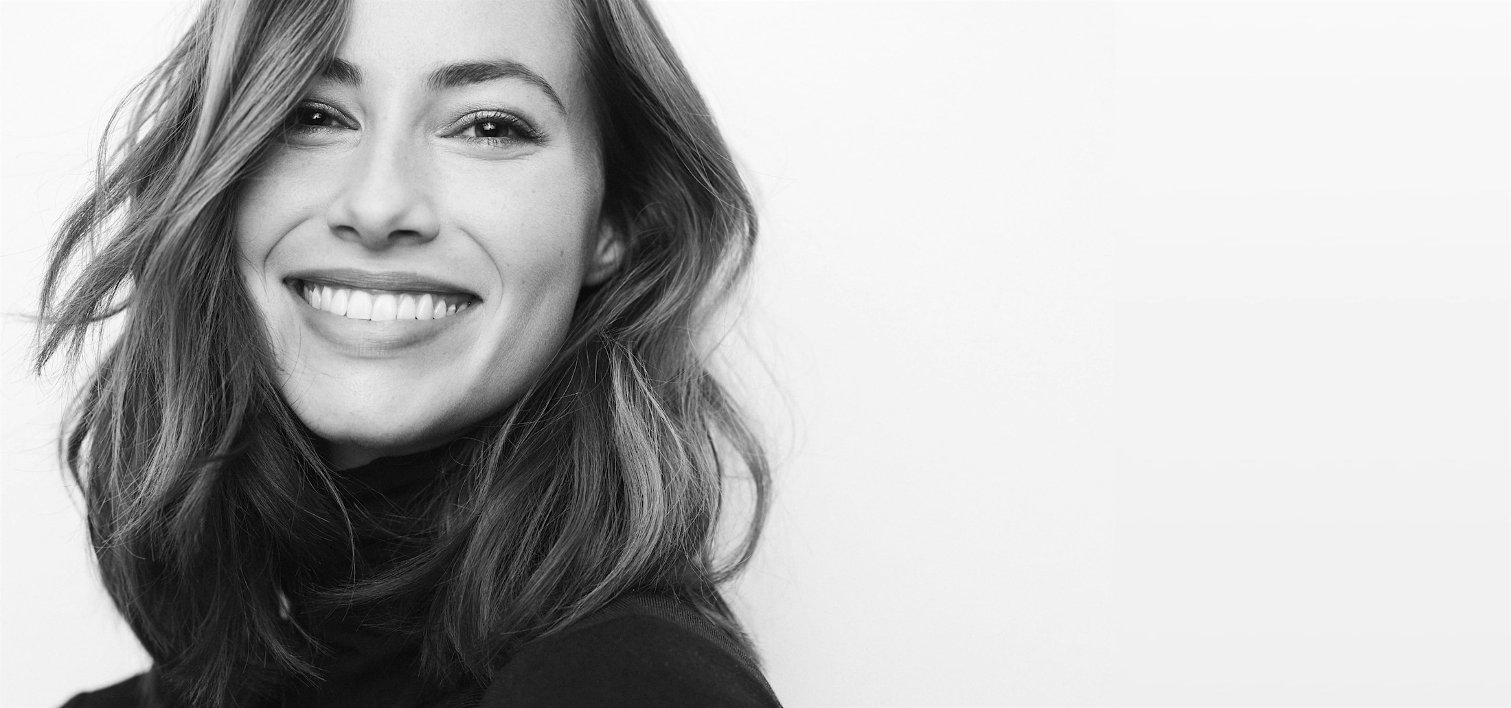 a woman smiling after seeing a dentist in Bluffton and Hilton Head