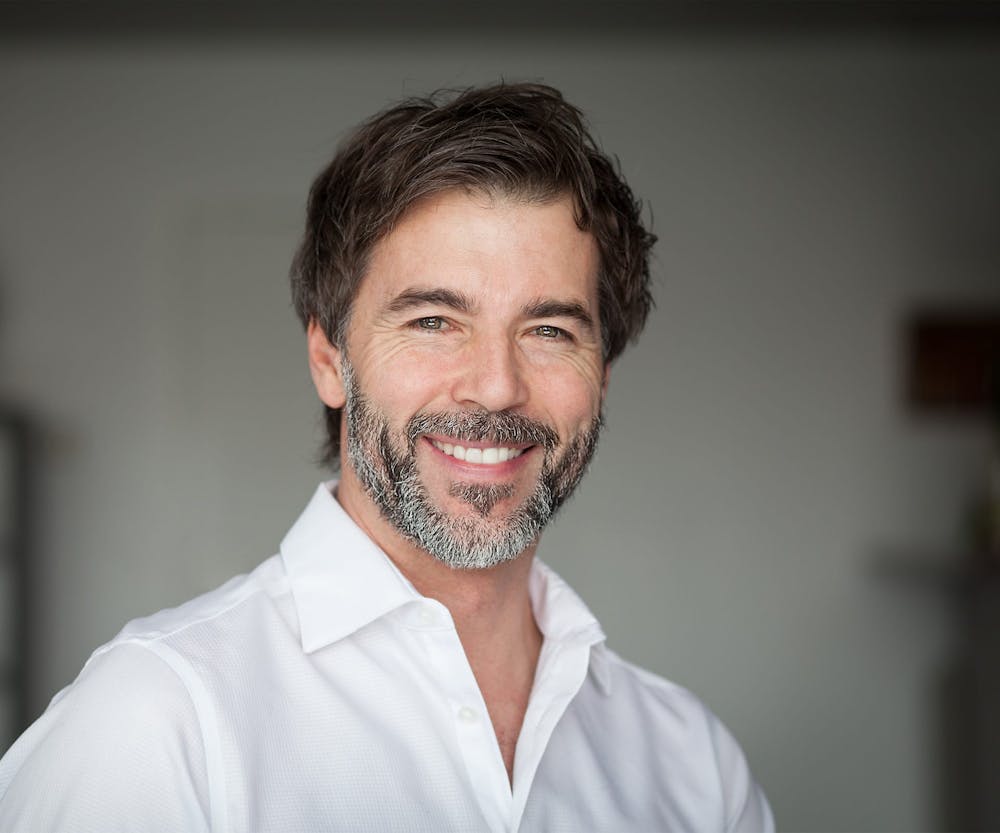 older man in white shirt