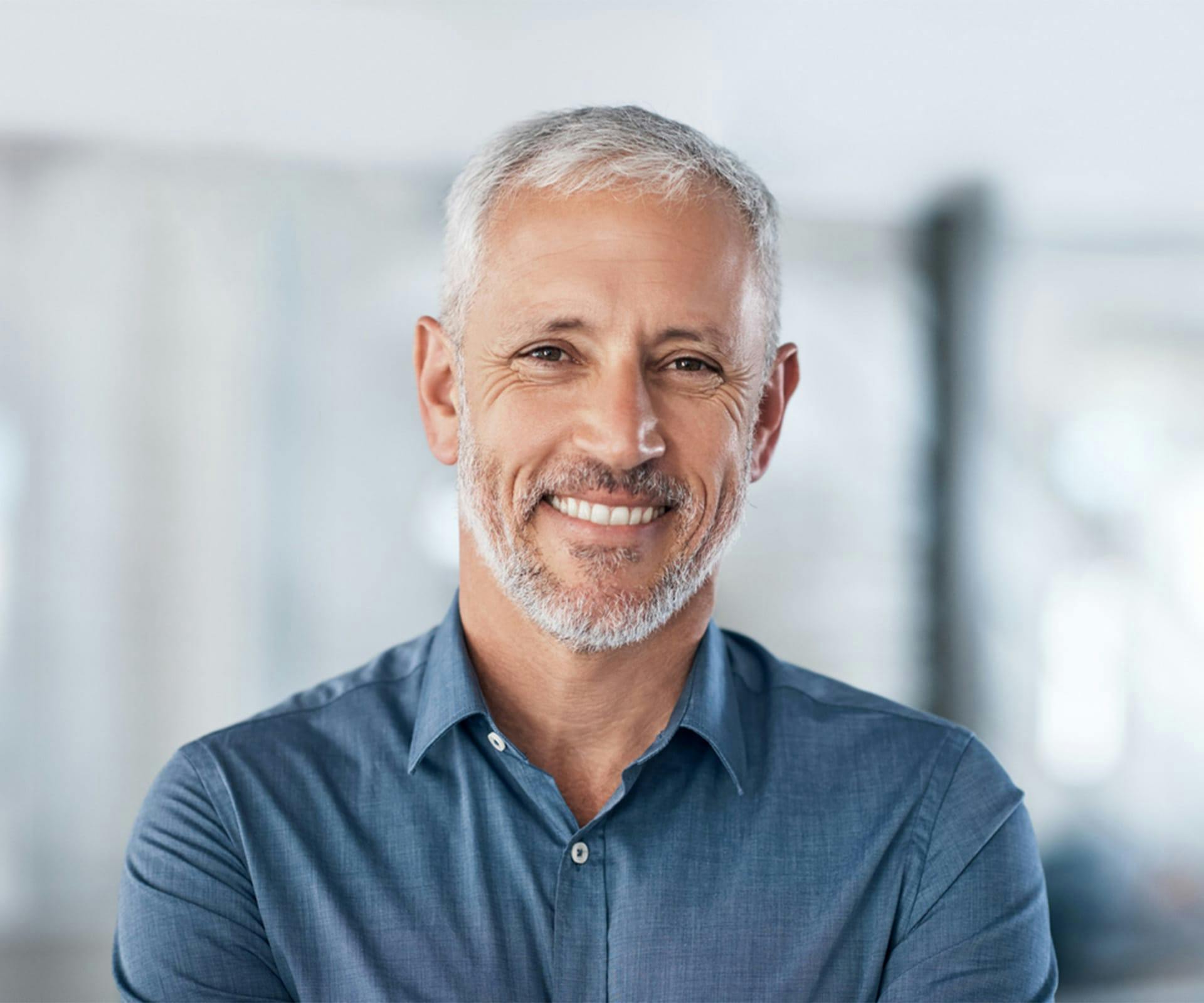 a man smiling after getting a root canal in Bluffton and Hilton Head