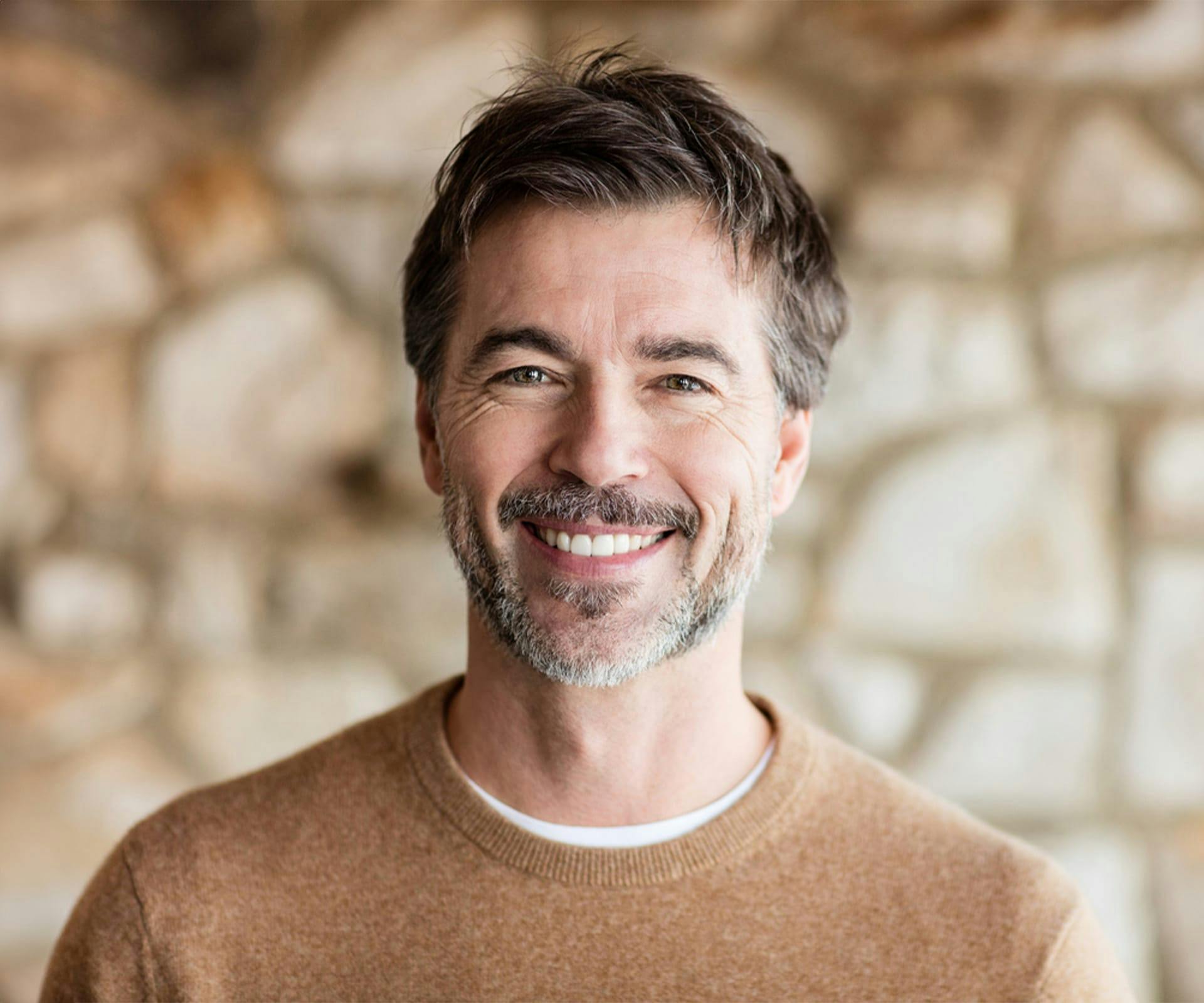 a smiling man after getting teeth whitening in Bluffton and Hilton Head