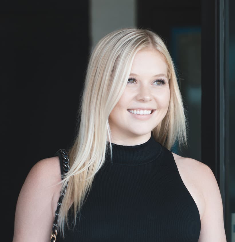 Blonde Woman Wearing a Black Turtleneck