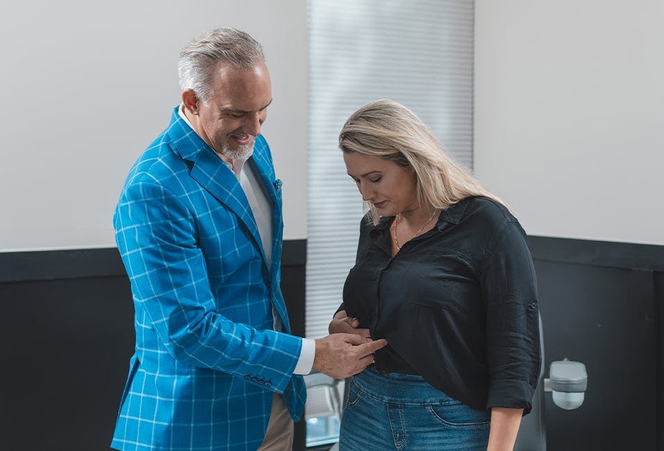 Dr. Burgdorf Pointing Out Something on the Patient's Stomach