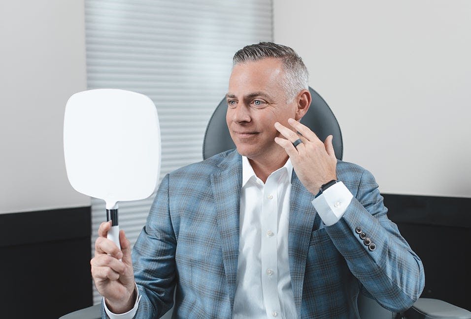 Patient Looking at His Reflection in the Mirror