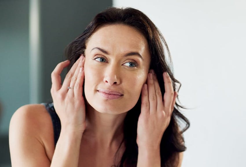 Woman Looking at Her Reflection
