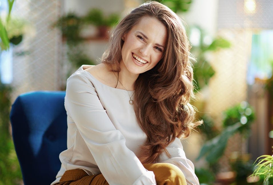 Woman Smiling with Long Brown Hair