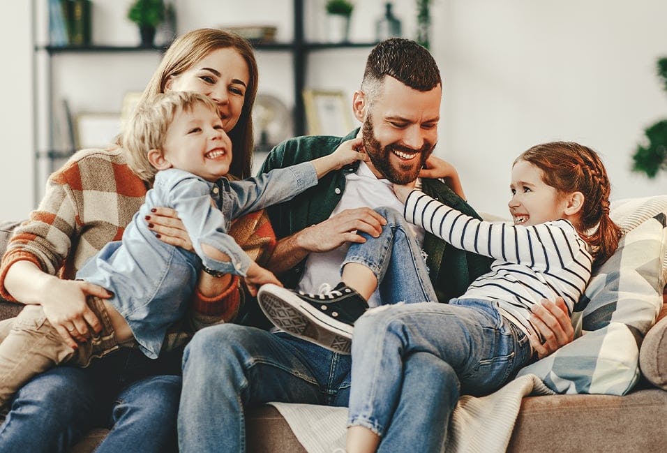 Family Playing on a Couch