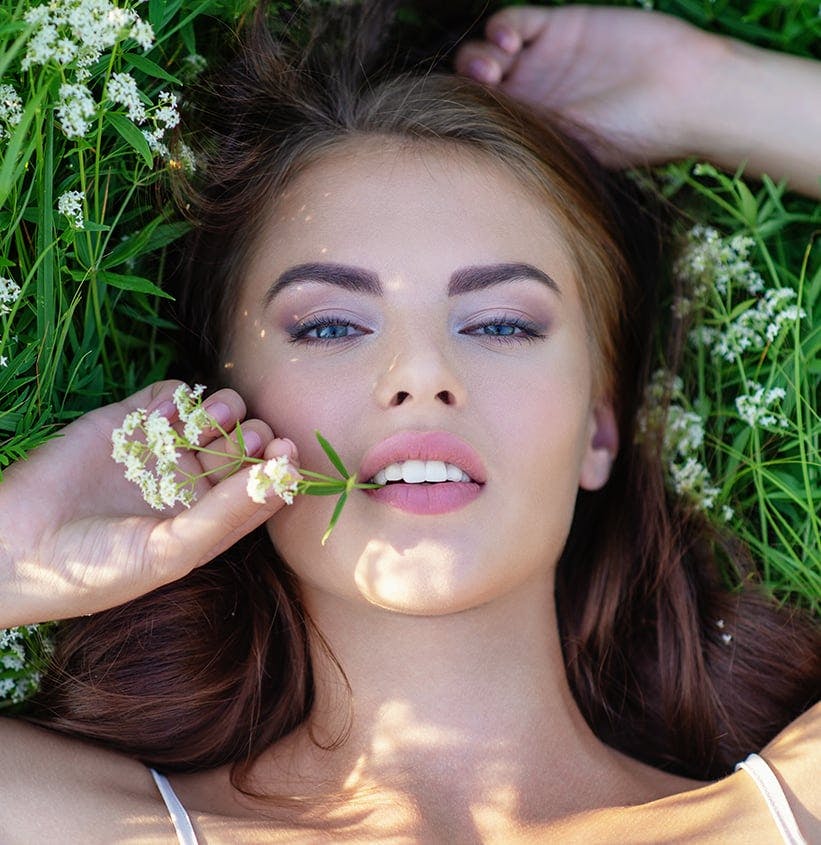 Woman Laying in the Grass