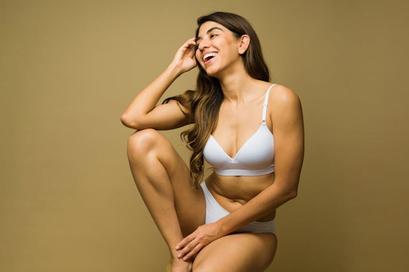 Woman sitting down on stool